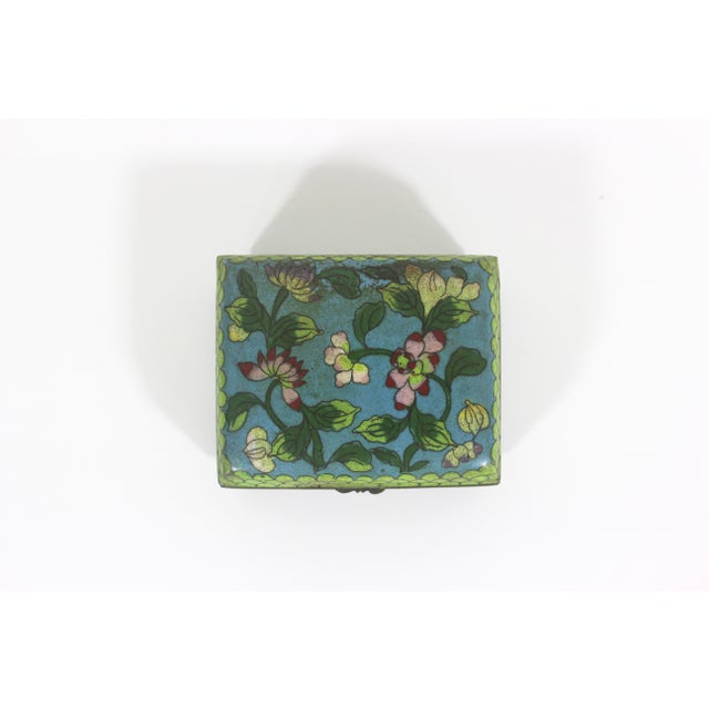Just beautiful antique Chinese Cloisonné box. Such amazing work and beautiful colours with flowers. This has a brass base...