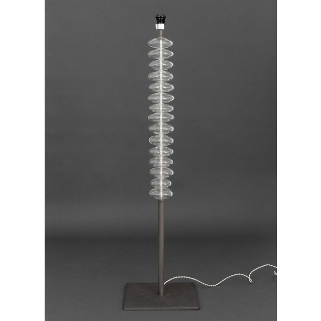 Jean-Marie Massaud for Poltrona Frau "Fede" Floor Lamp, the spiral form Murano clear glass on steel square base. 60" H x...