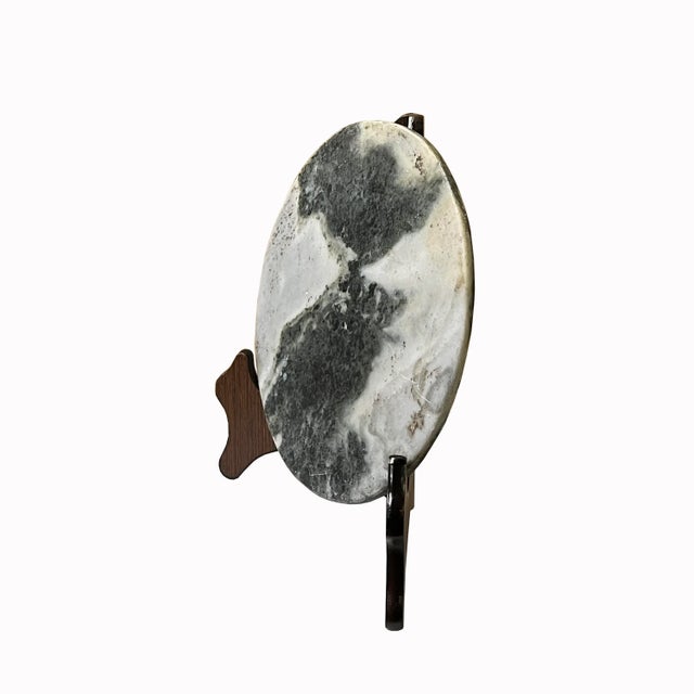 This is a round shape natural stone display with a natural abstract pattern. It is a nice unique accent piece for home...