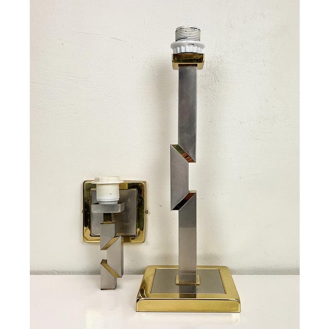 Stylish table lamp and matching wall lamp made of Chrome and Brass in a very beautiful Z-design. Rare pair and great...