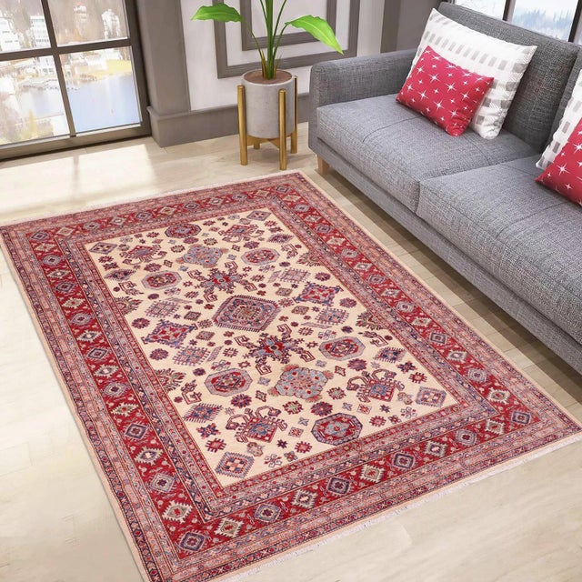 Embellish your home with this exquisitely hand-knotted super Kazak Rug made with the finest hand-spun wool and all...