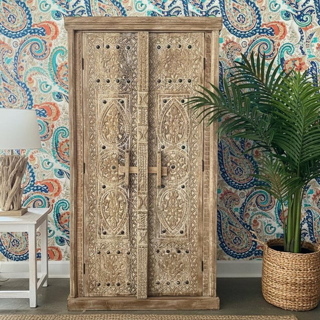 Bring understated elegance and rustic charm into your home with this vintage whitewashed wood armoire. Beautifully hand-...
