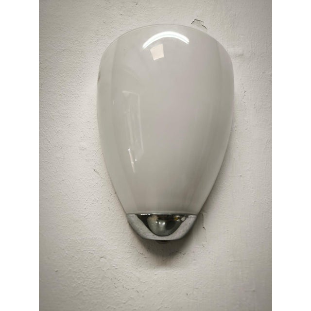 Chrome Wall Light with Opal Glass, 1990s, in Very Good conditions. Designed 1990 to 1999 This piece has an attribution...