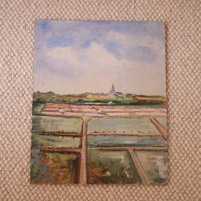 20th Century French Farmland Painting featuring a soft, atmospheric view of cultivated fields divided by narrow pathways...