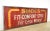 Reclaimed movie set sign made of aluminum in a yellow, red, and white color. The sign reads "Shoes, Fit - Comfort - Style...
