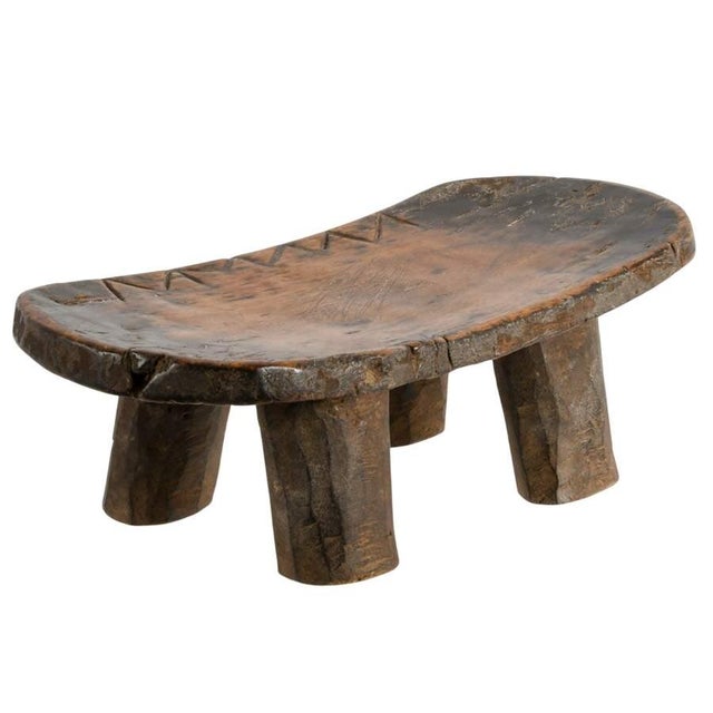 Sculptural in form and deeply resonant in presence, this antique Senufo-style hand-carved wood stool embodies the quiet...