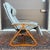 A mid century modern Plycraft Zero Gravity lounge chair in gray leather and canvas with a triangular bentwood base. Two...