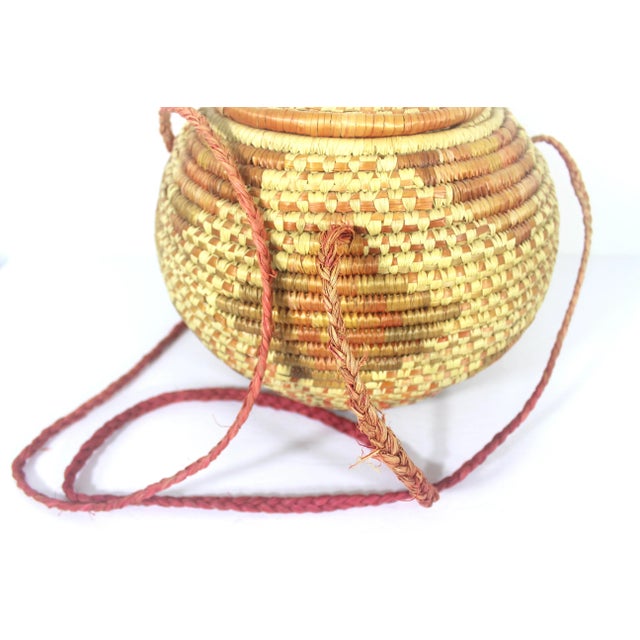 Vintage African Coiled Straw Lidded Two Tone Orange Hand Woven Covered Basket With Straps For Sale - Image 9 of 10