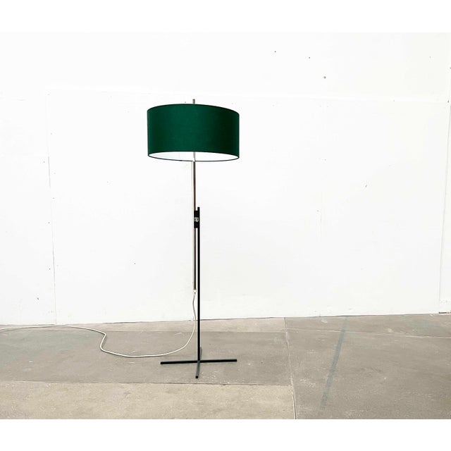 Rare mid-century floor lamp from Kaiser Leuchten with a special minimalist base. The special detail of this lamp is the...