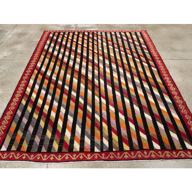 A vintage Turkish Art Deco style small room size carpet handmade during the mid-20th century. Measures: 7' 8" x 9' 6".
