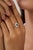 This halo engagement ring features a 0.32 carat pear-shaped blue sapphire set in 18K white gold. The sapphire measuring...