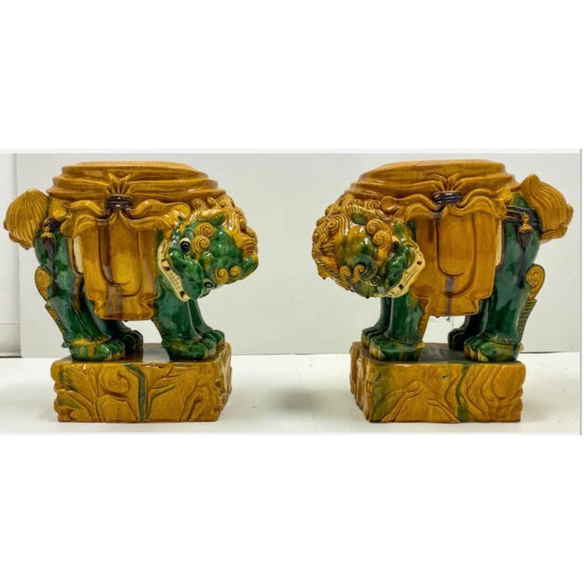 This is a facing pair of mid-century Italian terracotta foo dog garden seats in very good condition. They are unmarked.