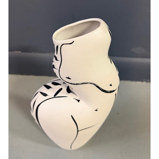 This sculptural ceramic vase by Donna Polseno beautifully captures the grace and sensuality of the human form. Hand-built...