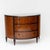Art Deco chest of drawers in demi-lune shape with three drawers and inlaid glass top. The chest of drawers stands on...