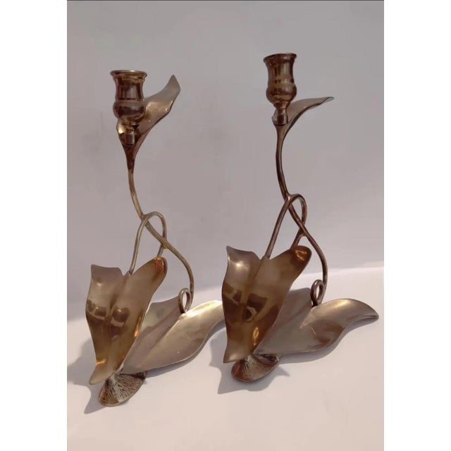 For your consideration. . . A rare pair of fabulous brass candle holders by Dolbi Cashier, circa 1980. This stunning pair...