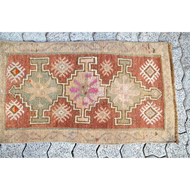 This is a vintage Turkish Oushak rug from the 1960s. The piece was hand-knotted.