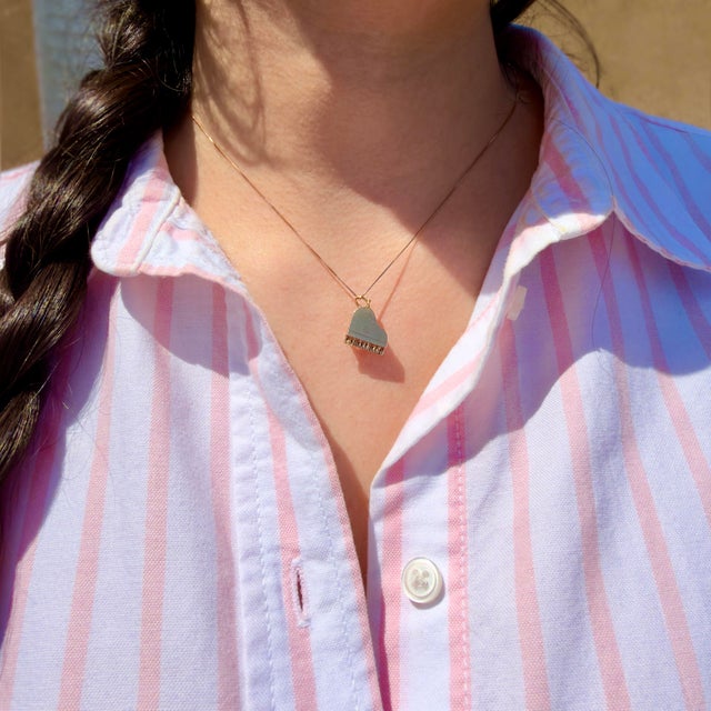 About This Charm: A circa 1950s piano charm with a working articulating lid that opens and closes—a charming detail that...