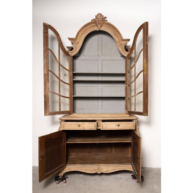 An exceptional and monumental French Louis XV style buffet deux corps standing approximately nine feet tall. Crafted of...