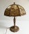 Beautiful slag glass lamp. No brand name markings but this is very possibly produced by Edward Miller & Co. Needs some...