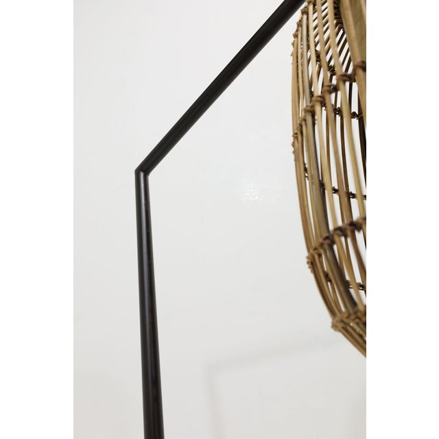 The Kai Z floor lamp from designer Kenneth Cobonpue, inspired by eastern design, features hand laid palm leaf spines that...