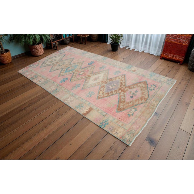 This is a beautiful, one-of-a-kind vintage Turkish rug, hand-knotted by artisans in the Anatolia region. Unlike a flat-...