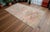This is a beautiful, one-of-a-kind vintage Turkish rug, hand-knotted by artisans in the Anatolia region. Unlike a flat-...