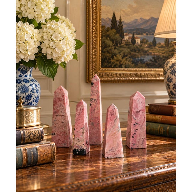 A handsome collection of five vintage solid marble obelisks, executed in richly varied shades of rose pink, blush, and...
