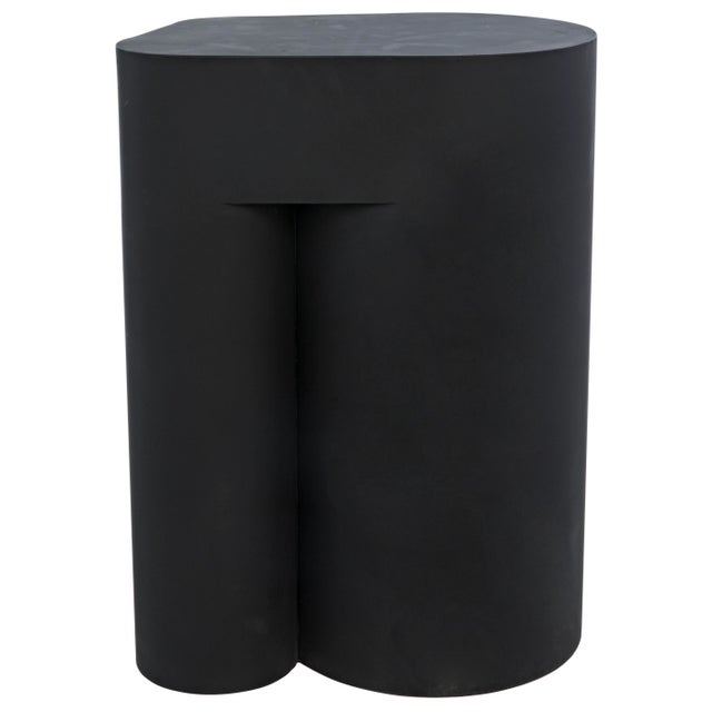 Bold, bodacious, and not at all boring, this black metal side table is an ideal addition to a contemporary space.