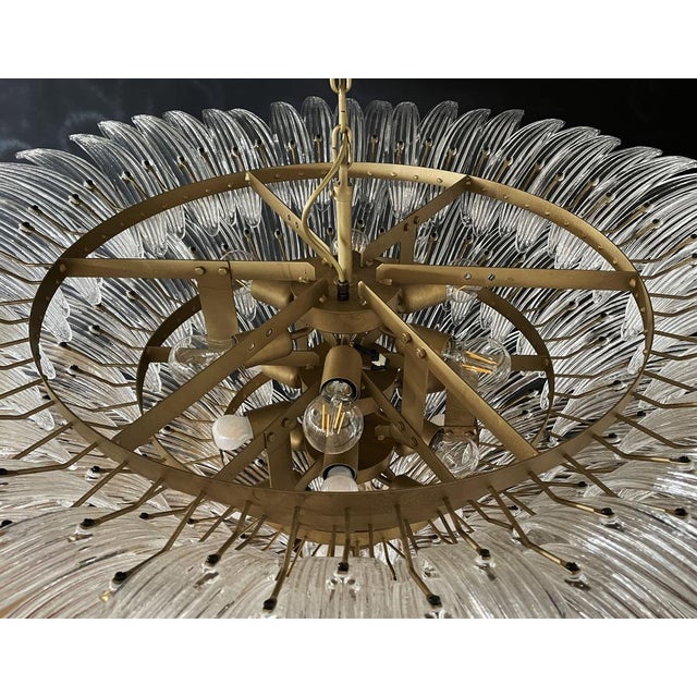 Palmette ceiling light made by 163 Murano trasparent glasses in a gold metal frame. Murano blown glass in a traditional...