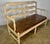 French Provincial style ladder back settee w/ leather cushion & rush seat. The bench stand on six straight legs connected...