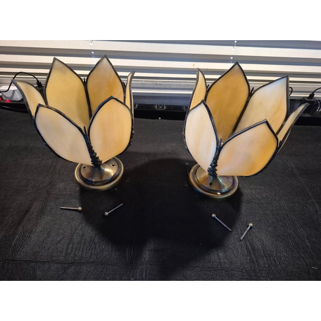 These are a pair of ceiling mounted vintage Art Nouveau or Art Deco-style 5-panel tulip slag glass ceiling light fixtures....