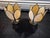These are a pair of ceiling mounted vintage Art Nouveau or Art Deco-style 5-panel tulip slag glass ceiling light fixtures....
