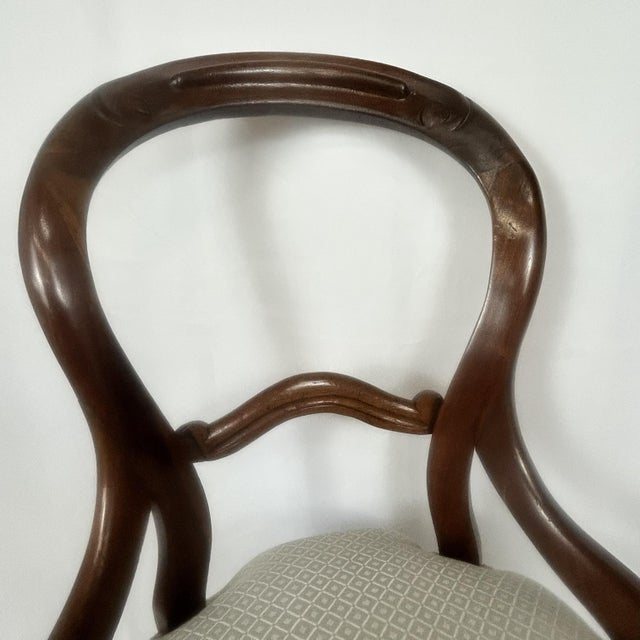 Fine quality traditional form most likely mahogany Victorian balloon-back chair, upholstered in light patterned fabric....