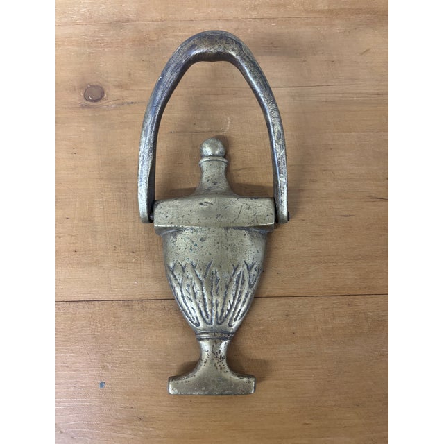 An exquisite antique English brass door knocker. Beautifully worn detail of leaves and rope. Hand selected in imported...