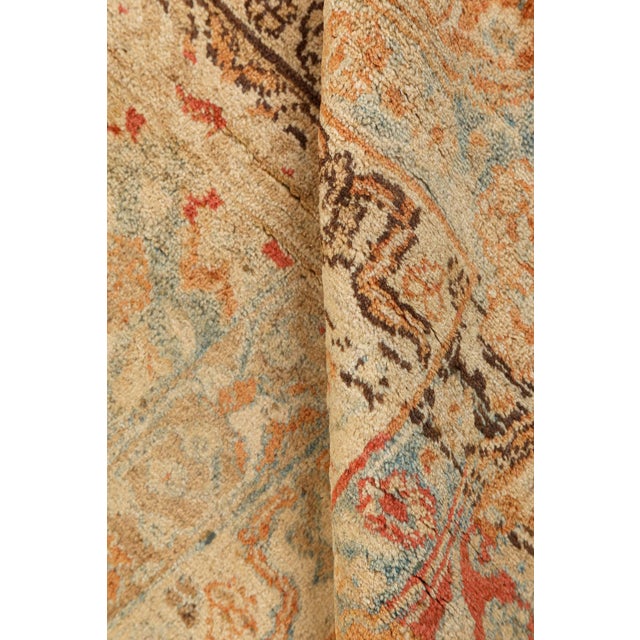 Masterfully crafted in the renowned weaving city of Tabriz, this exquisite oversized Persian rug from the 1880s is a...
