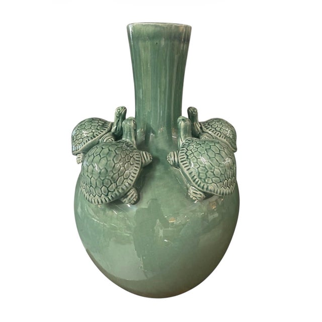 Add a touch of playful sophistication to your interior with this unique ceramic statement vase. Finished in a luminous,...