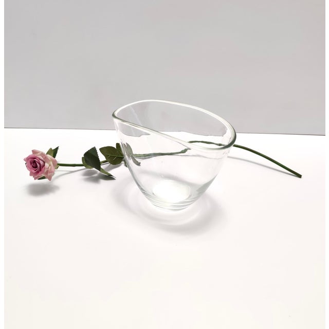 Made in Italy, 1950s. This is an elegant and essential hand-blown transparent Murano glass vase. It is a vintage piece,...