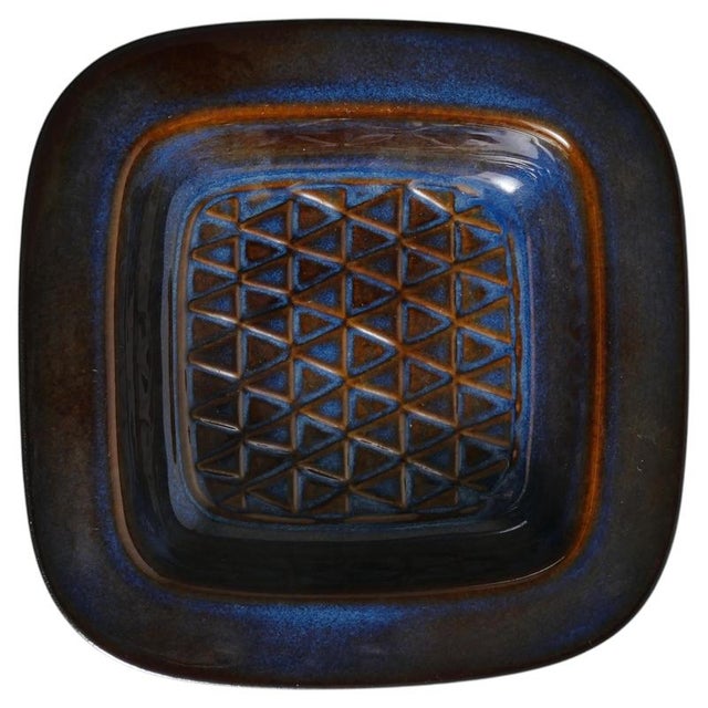 Handcrafted in the mid-20th century, this exquisite stoneware dish or catchall bears the distinctive mark of søholm...