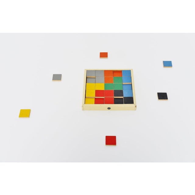 Very rare puzzle tiles box model 259. Designed by ko verzuu for ado holland in 1939. Ado means arbeid door onvolwaardigen,...