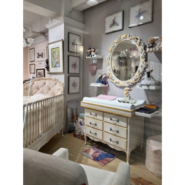 This mirror is by Notte Fatata, designed by Savio Firmino. The frame features hand-carved roses, leaves, and vines. It is...