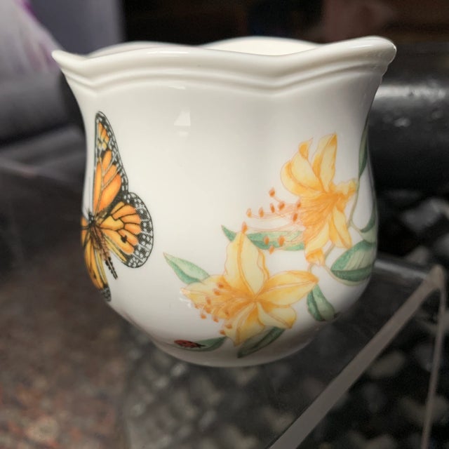 Pretty miniature vase with colorful butterflies, flowers and a lady bug.