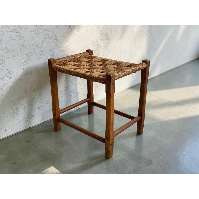 A charming mid-century modern stool produced in Europe during the 1960s. The piece features a solid wooden frame combined...