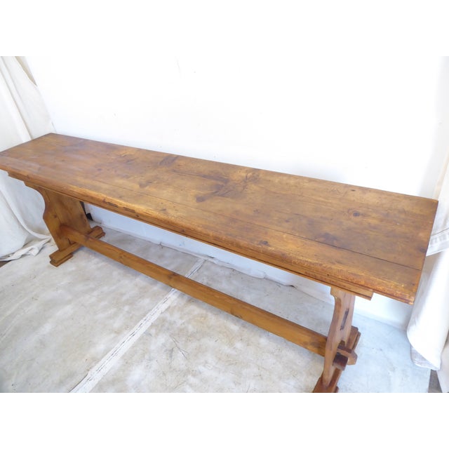 This weathered, rustic pine console table has a crossbar and is 28.5"H x 84"L x 17.25"D.