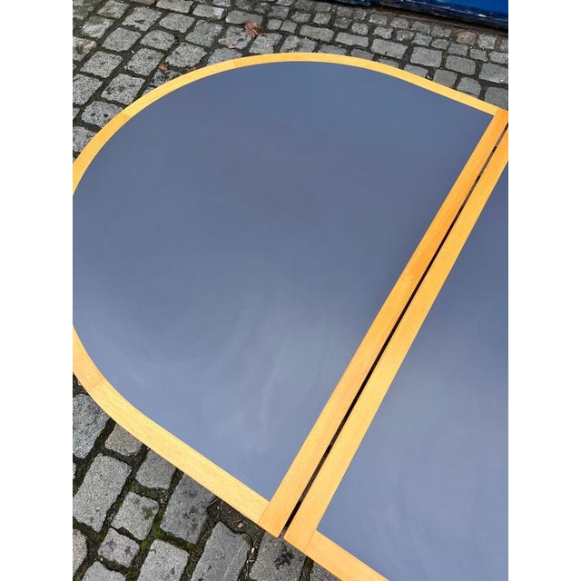 This semicircular dining table is typical of the functional and aesthetic design of the Danish duo Rud Thygesen & Johnny...