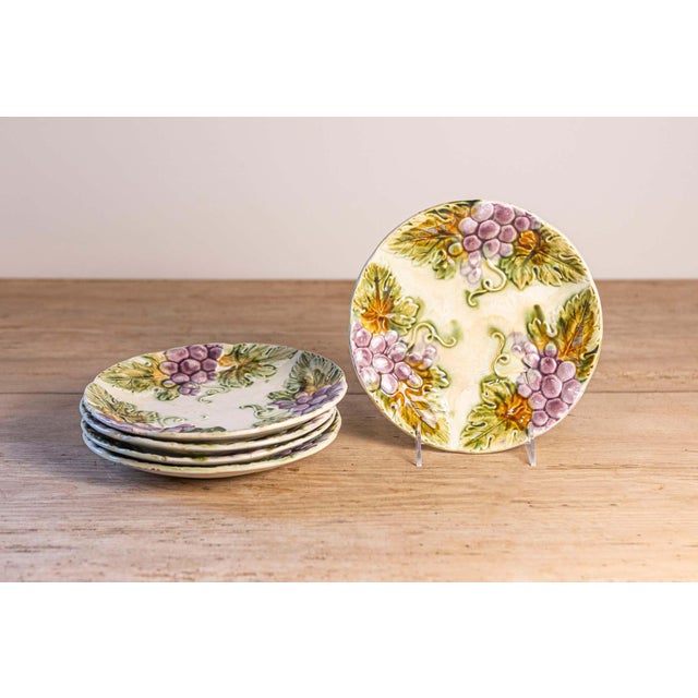 French Majolica dining plates from the 19th century, with purple grapes and their leaves. We currently have eight plates...