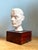 This refined vintage plaster bust of a man reflects a harmonious blend of classical influence and mid-20th-century...