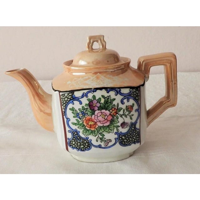This marvelous Made in Japan vintage tea pot is created in a gorgeous ceramic pottery with a lusterware glaze and hand...
