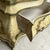 This is a mid-century Italian Venetian hand painted bombe commode with a faux marble top. The chest has a floral motif...