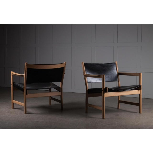 Design Alf Svensson. Black Leather and Oak. Produced by Best Möbelsnickeri, Sweden, 1960s. This piece is attributed to the...