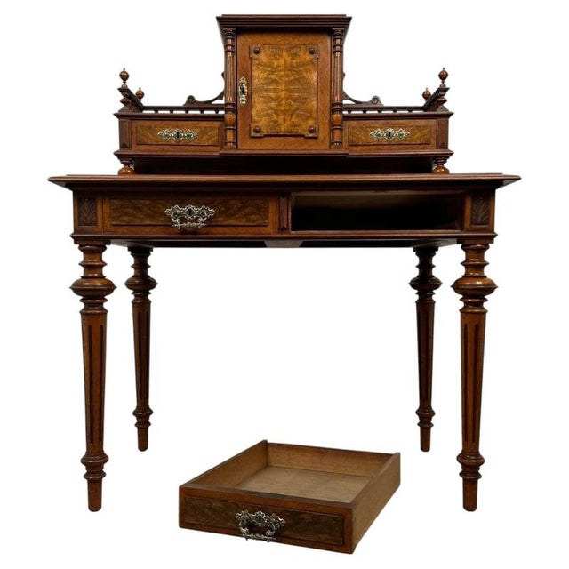 A magnificent 19th-century French writing table, finely crafted from walnut and distinguished by exceptional burr walnut...